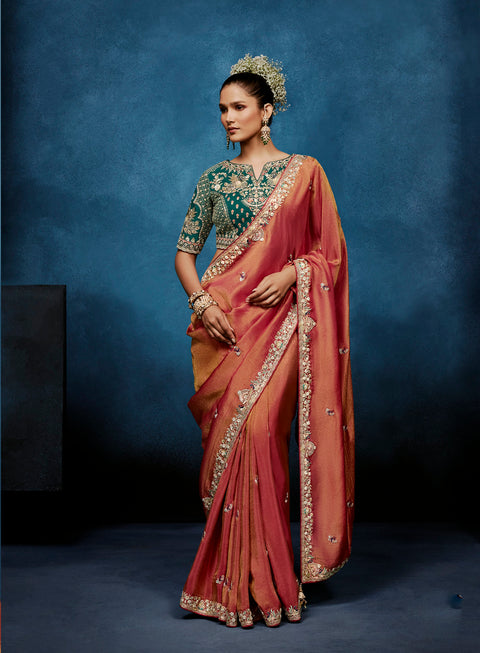 Peach tissue silk saree with intricate heavy work