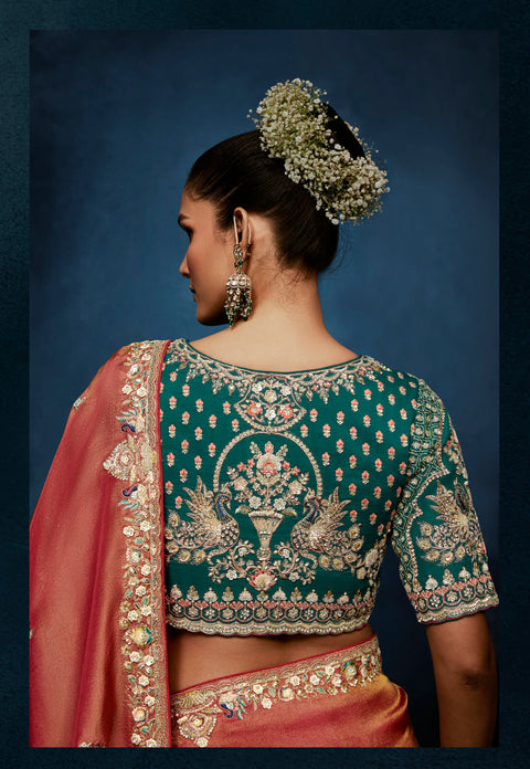 Peach tissue silk saree with intricate heavy work
